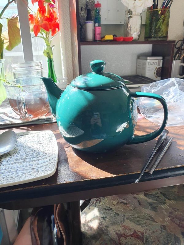 1. Sweejar Porcelain Teapot with Infuser and Lid