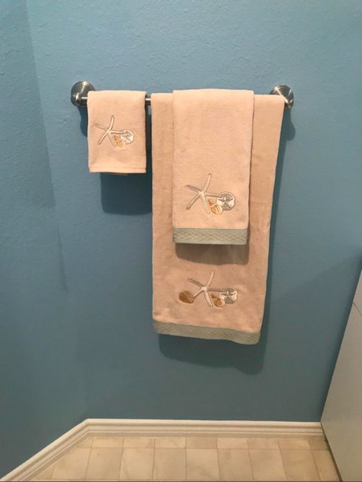 1. Amazon Basics Modern Bathroom Towel Straight Bar Rack